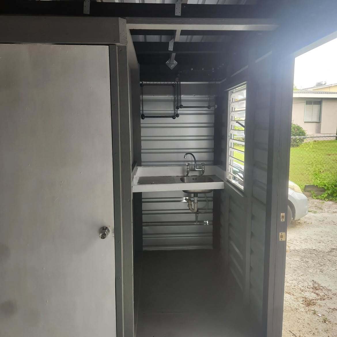 Interior with a sink and shelving